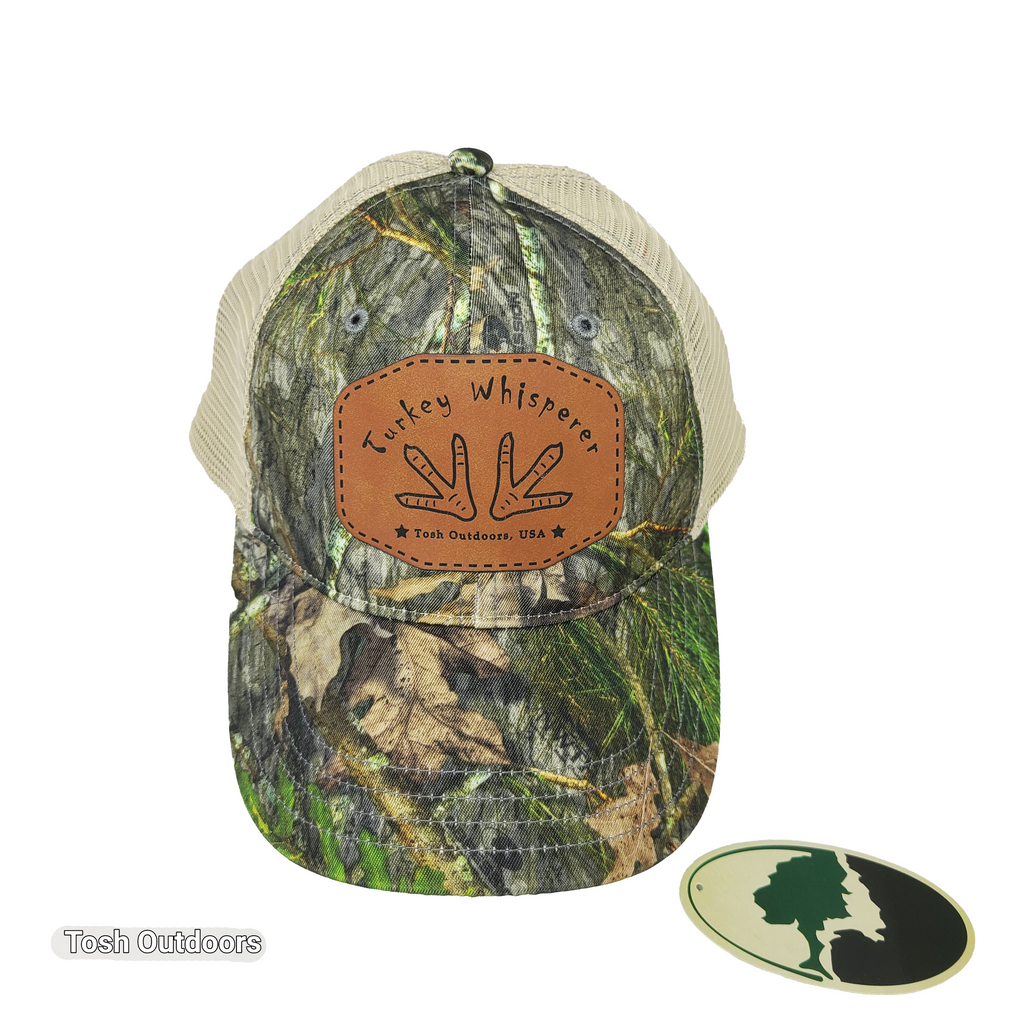 Tosh Outdoors. This cap is for you. Wear it on the hunt, on the job, on the road or anywhere else... Licensed Mossy Oak Realtree 100% Polyester twill 100% Polyester mesh back for those warm days Unstructured, six-panel, low profile Pre-curved visor Cotton sweatband Adjustable snapback closure Size MD-LG (7"-73/4")